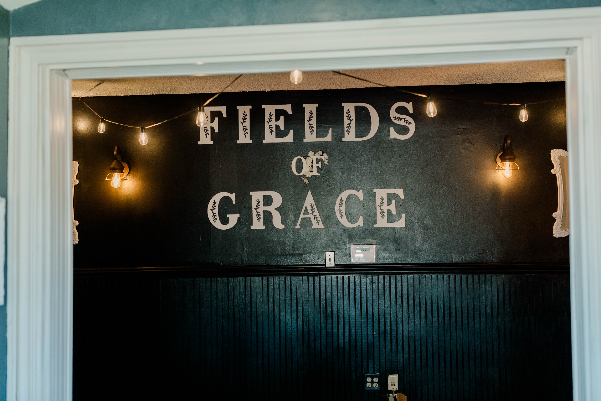 The Signature Wall — Fields of Grace in lights at Fields of Grace Farmhouse in Lake Butler, FL